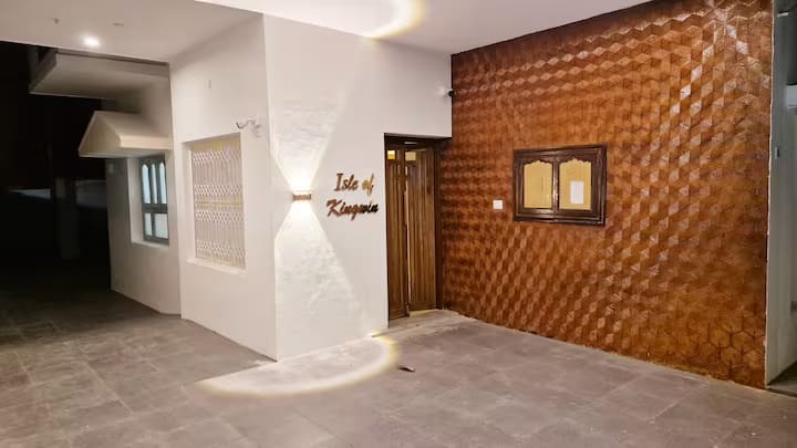 The entrance porch with a textured brick feature wall and the Kingwin nameplate
